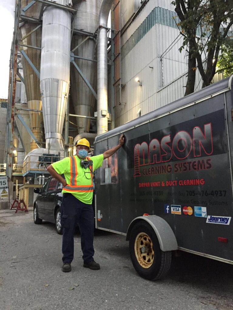 Mason Cleaning Systems technicians using specialized equipment for professional HVAC and chimney maintenance in North Bay.
